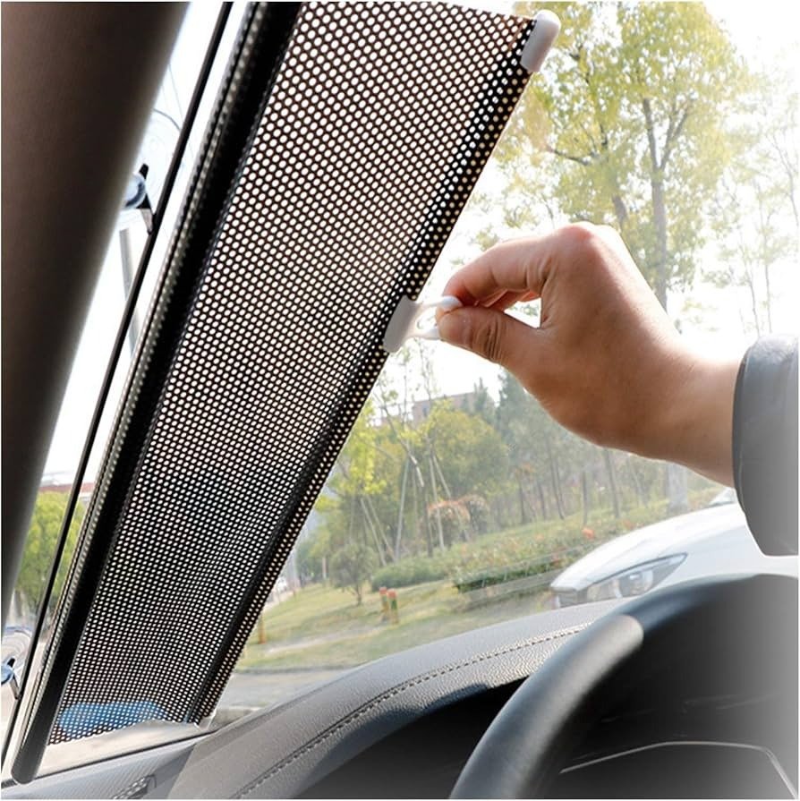 Automatic vs magnetic window sunshades showing magnetic mesh sunshade fitted on car window